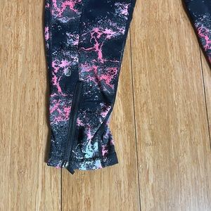 Lululemon leggings black pink and grey cropped length with zipper.